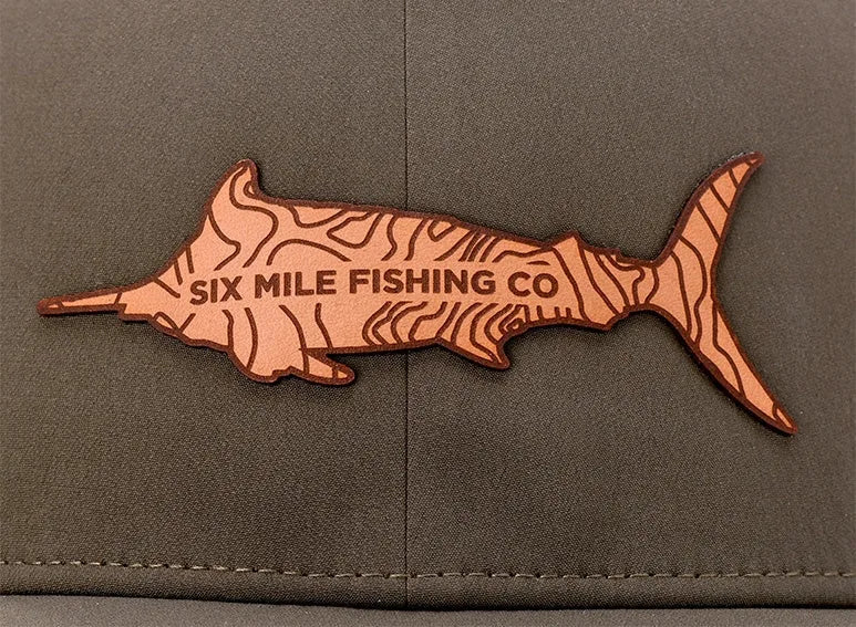Laser-etched leather patch with fine lettering
