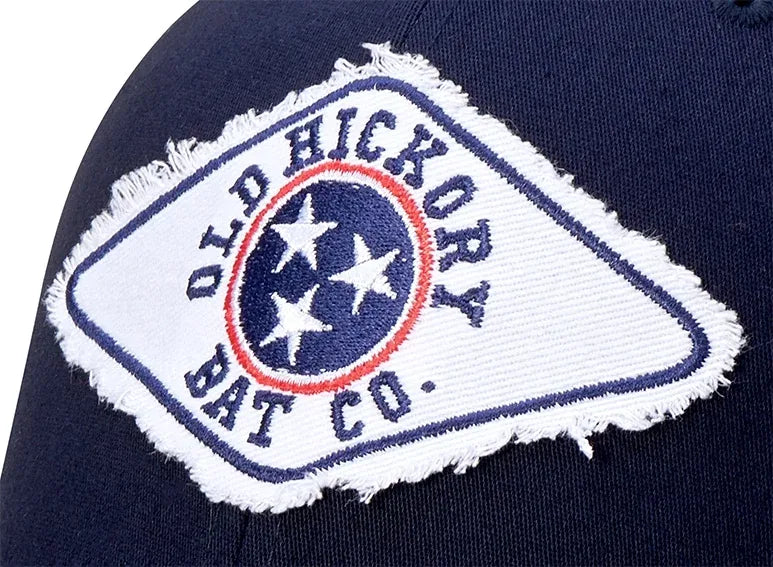 Distressed embroidered patch on a washed cap