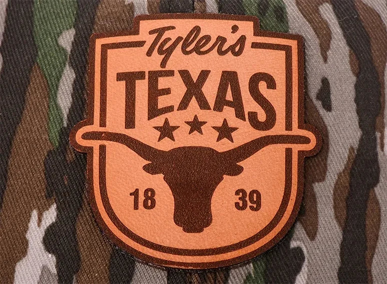 Etched leather patch on a cap