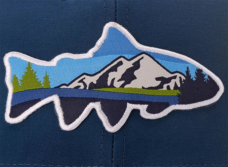 Woven trout patch with a mountain scene on a navy cap