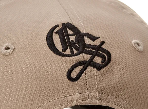 Tonal embroidered monogram on a tan cap