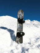 Ride Warpig Snowboard 2027 mounted with bindings in backcountry snow